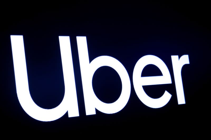 FILE PHOTO: A screen displays the company logo for Uber Technologies Inc. on the day of it's IPO at the NYSE in New York