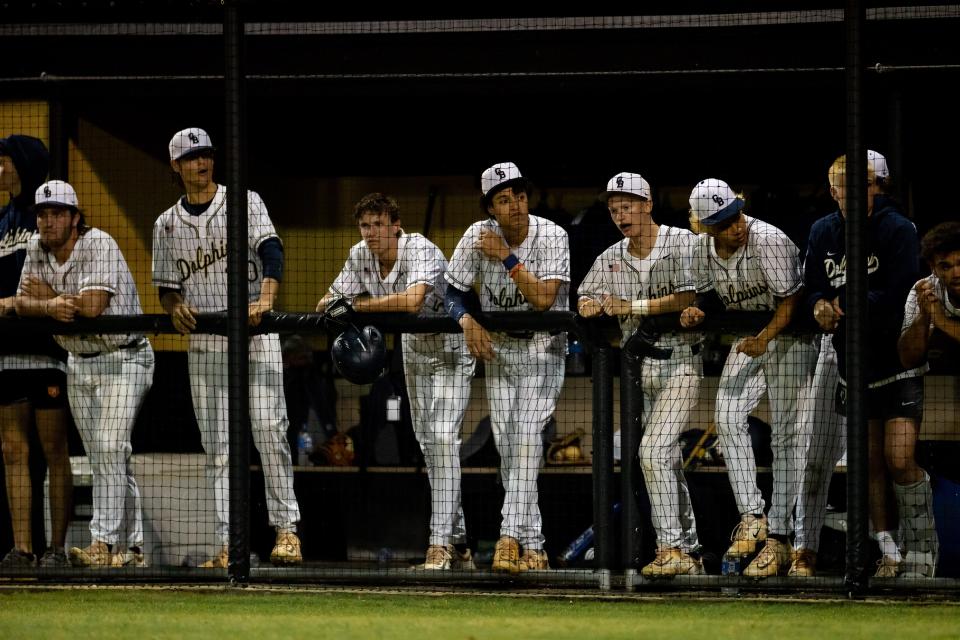 Gulf Breeze Dolphins players look on during the game against the Buchholz Bobcats at the 2023 FHSAA Baseball State Championships 6A Regional Quarterfinal at Bobcat Park at Buchholz High School in Gainesville, FL on Wednesday, May 10, 2023. [Matt Pendleton/Gainesville Sun]