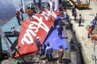 December 28, 2014 - Indonesia AirAsia Flight 8501 crashed into the waters off Borneo killing all 155 passengers and seven crew on board. As of March 2015, 106 of the 162 bodies on the Singapore-bound aircraft have been recovered. Investigations found the airplane had stalled during an abnormally steep climb and failed to recover. In addition to highlighting the lack of weather radar at Indonesian air traffic control centres, the tragedy raised the point that commercial aircraft should have ejectable, floating black box recorders. REUTERS/Antara Foto/Yudha Manx