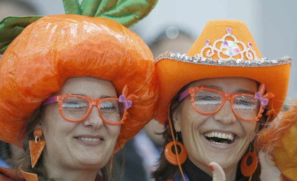 Netherland's fans smile during the men's 5000 meters speed skating race at the 2014 Sochi Winter Olympics