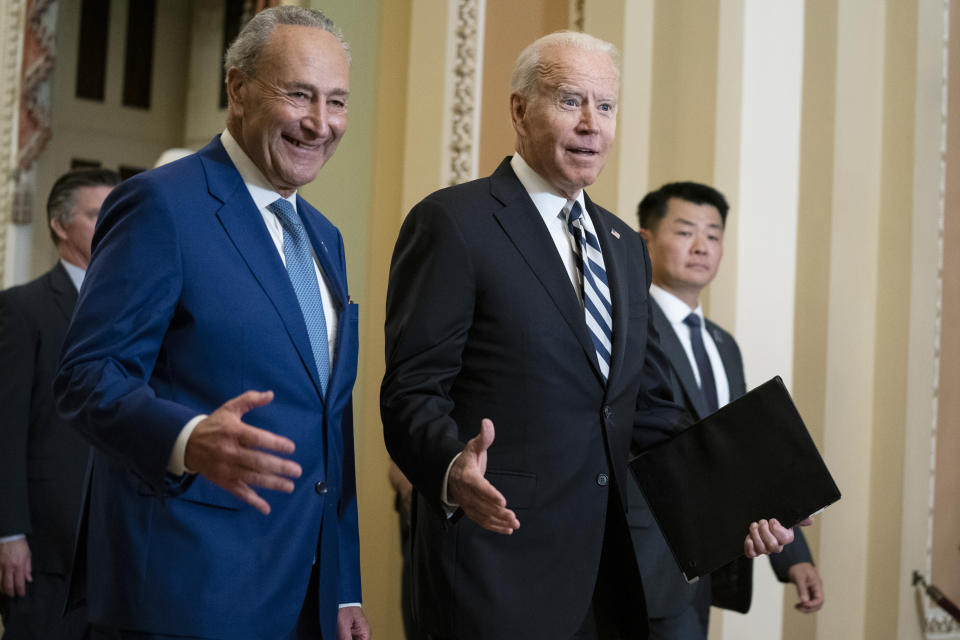 Senate Majority Leader Sen. Chuck Schumer of N.Y., walks with President Joe Biden as he arrives on Capitol Hill to meet with Senate Democrats, Wednesday, July 14, 2021, in Washington. (AP Photo/Evan Vucci)