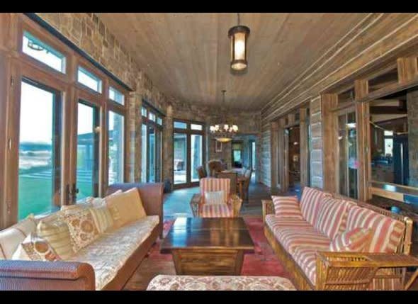 A Craftsman-style sunroom with ample seating.