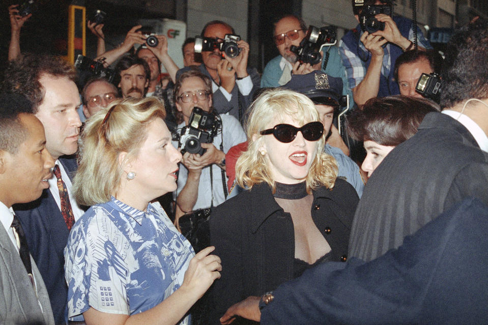 FILE - In this June 25, 1992, file photo, Madonna arrives at the Ziegfeld Theater for the opening of the film "A League Of Their Own" in New York. The Associated Press has compiled a list of the best sports movies ever made — a one-of-a-kind AP Top 25. "A League of Their Own" checked in at No. 10. (AP Photo/Luis Ribeiro, File)