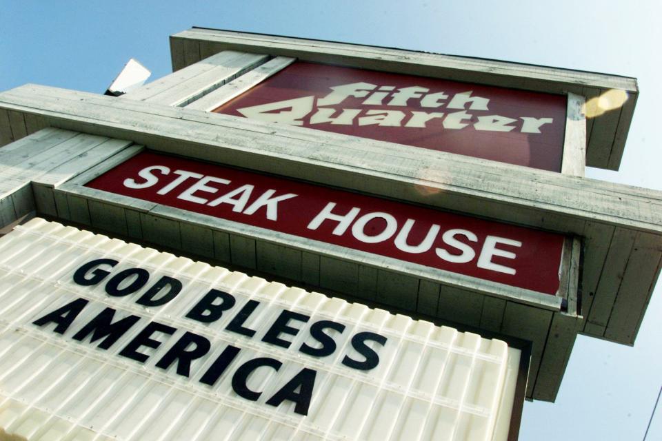 A sign at the Fifth Quarter Steak House reads "God Bless America" Sept. 12, 2001, a popular slogan for numerous businesses along Murfreesboro Road after the World Trade Center aftermath.