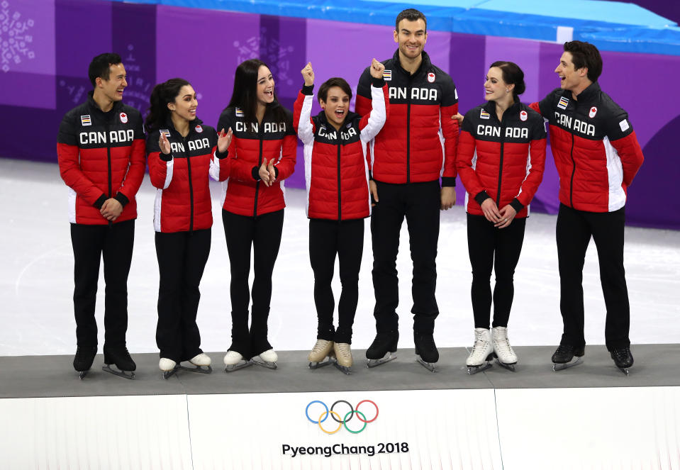 <p>Gold medalists Team Canada celebrate on the podium in the victory ceremony after the Figure Skating Team Event. The Olympic Athletes from Russia won silver and the USA won bronze. </p>