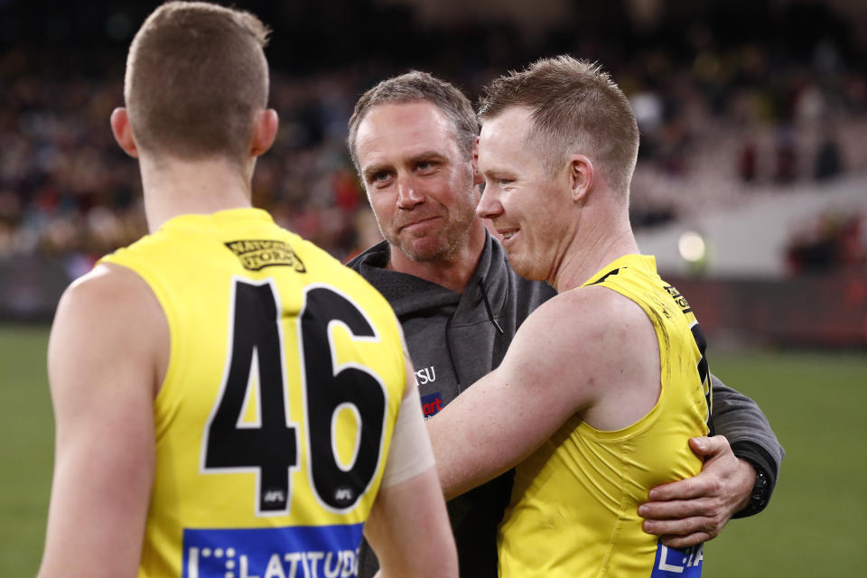 Ben Rutten (pictured middle) and Jack Riewoldt (pictured right) embrace after the AFL star.