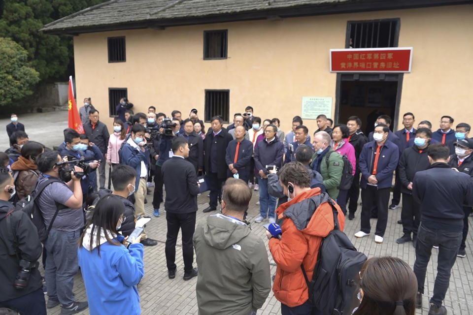 Students at the China Executive Leadership Academy gather in front of a revolutionary military outpost to listen to a field lecture in Jinggangshan in southeastern China's Jiangxi Province, on April 9, 2021. As China celebrates the 100th anniversary of its 1921 founding, such trainings are part of efforts by President Xi Jinping's government to extend party control over a changing society. (AP Photo/Emily Wang)