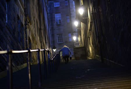 A woman walks up a steep staircase in the centre of Edinburgh, Scotland September 11, 2014. REUTERS/Dylan Martinez