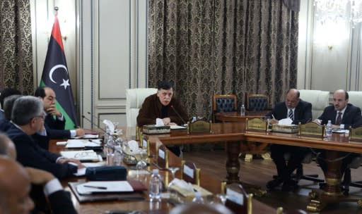 Libya's UN-recognised Prime Minister Fayez al-Sarraj (C) presided over a cabinet meeting where the implementation of a military deal with Turkey was 'unanimously approved'