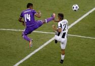 <p>Real Madrid’s Casemiro in action with Juventus’ Paulo Dybala </p>