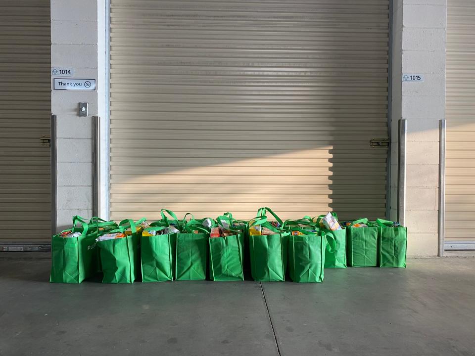 Bags of groceries packed by volunteers to hand out to furloughed and laid-off Disney employees.Richard Hall / The Independent