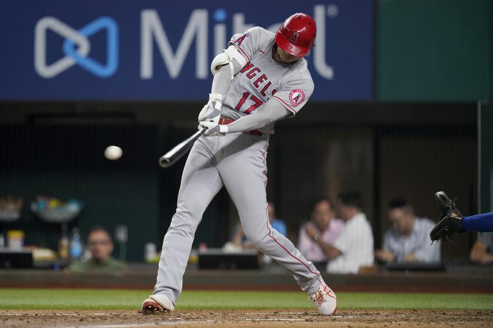 Los Angeles Angels' Shohei Ohtani connects for a double in the fifth inning of the team's baseball game against the Texas Rangers in Arlington, Texas, Tuesday, Aug. 3, 2021. (AP Photo/Tony Gutierrez)