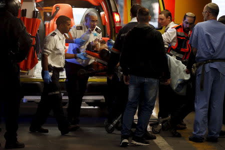 Israeli medics evacuate an Israeli man to Sha'are Zedek hospital in Jerusalem, December 7, 2015. REUTERS/Ammar Awad