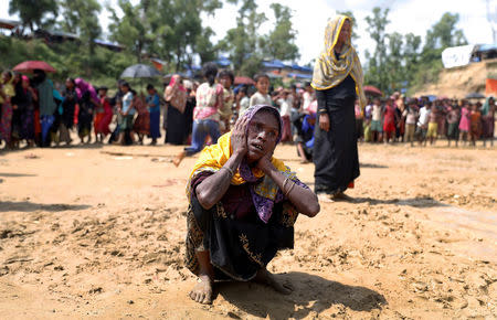 A woman reacts as Rohingya refugees queue for aid at Cox's Bazar, Bangladesh, September 26, 2017. REUTERS/Cathal McNaughton