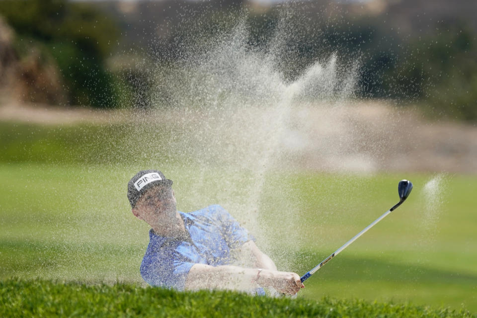 Mackenzie Hughes, of Canada, hits from the 17th fairway during the first round of the U.S. Open Golf Championship, Thursday, June 17, 2021, at Torrey Pines Golf Course in San Diego. (AP Photo/Marcio Jose Sanchez)