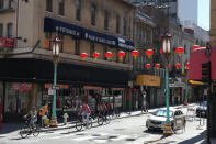 Bicyclists make their way along Chinatown's Grant Avenue in San Francisco, Wednesday, Oct. 18, 2023. A $4 million marketing campaign touting San Francisco's resilience, innovation and moxie launches Thursday, Oct. 19, as the embattled city prepares to host a high-profile Asia-Pacific Economic Cooperation leaders' summit next month that could boost its image or pile on to its woes. (AP Photo/Eric Risberg)