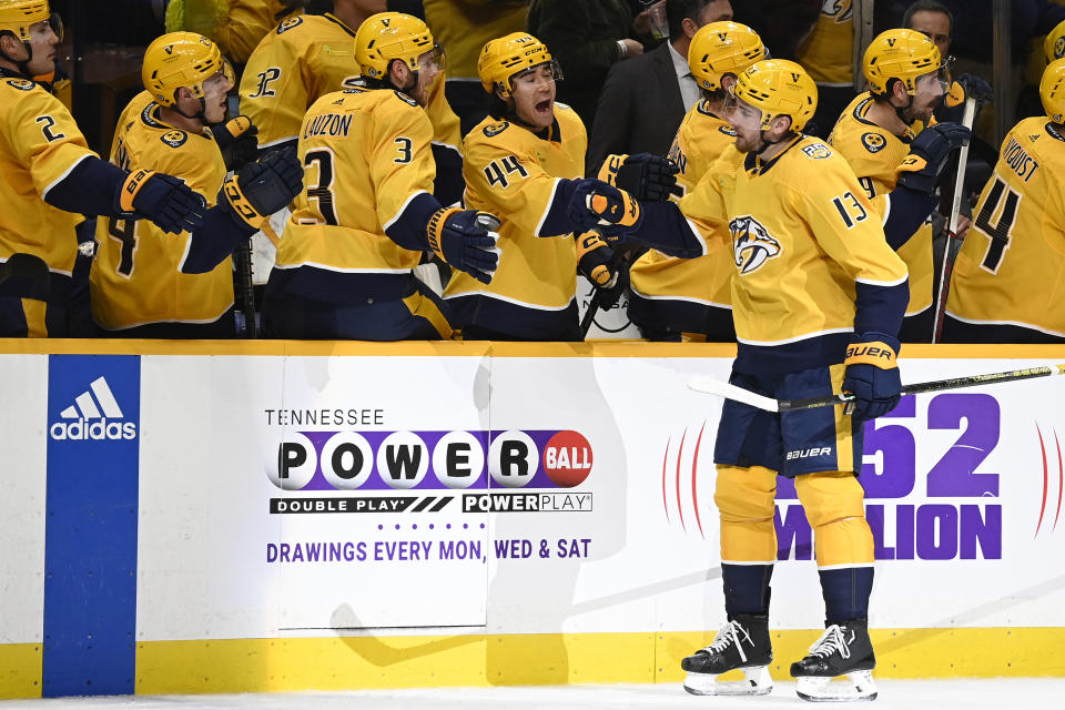 Nashville Predators center Yakov Trenin (13) is congratulated after scoring against the Winnipeg Jets during the first period of an NHL hockey game, Sunday, Nov. 26, 2023, in Nashville, Tenn. (AP Photo/Mark Zaleski)