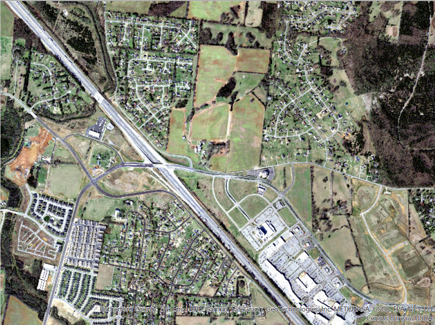 This 2012 aerial view shows the Williamson Family Farm in upper center seven years after the Murfreesboro government opened Medical Center Parkway off Interstate 24 with development that included The Avenue Murfreesboro shopping center on lower right.