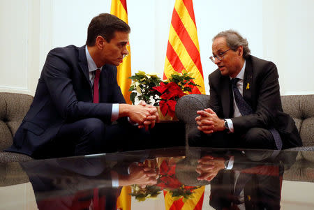 Spain's Prime Minister Pedro Sanchez and Catalan Regional President Quim Torra talk during a meeting at Palau Reial de Pedralbes in Barcelona, Spain December 20, 2018. REUTERS/Albert Gea