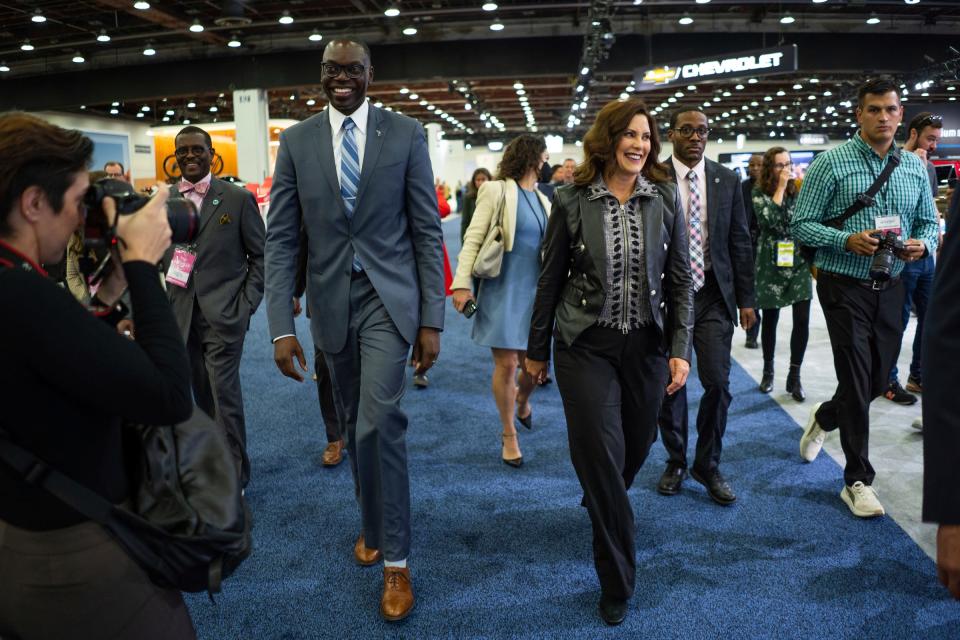Gov. Gretchen Whitmer and Lt. Gov. Garlin Gilchrist tour the floor during the 2023 North American International Auto Show held at Huntington Place in downtown Detroit on Thursday, Sept. 14, 2023.