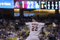 Arizona Diamondbacks' Josh Reddick, who normally plays outfield, pitches during the ninth inning of a baseball game against the Los Angeles Dodgers Saturday, July 10, 2021, in Los Angeles. (AP Photo/Mark J. Terrill)