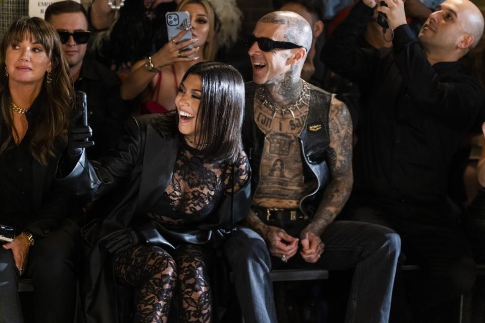 Boohoo CEO Carol Kane, Kourtney Kardashian (L) and Travis Barker attend the Boohoo X Kourtney Kardashian fashion show during New York Fashion Week: The Shows