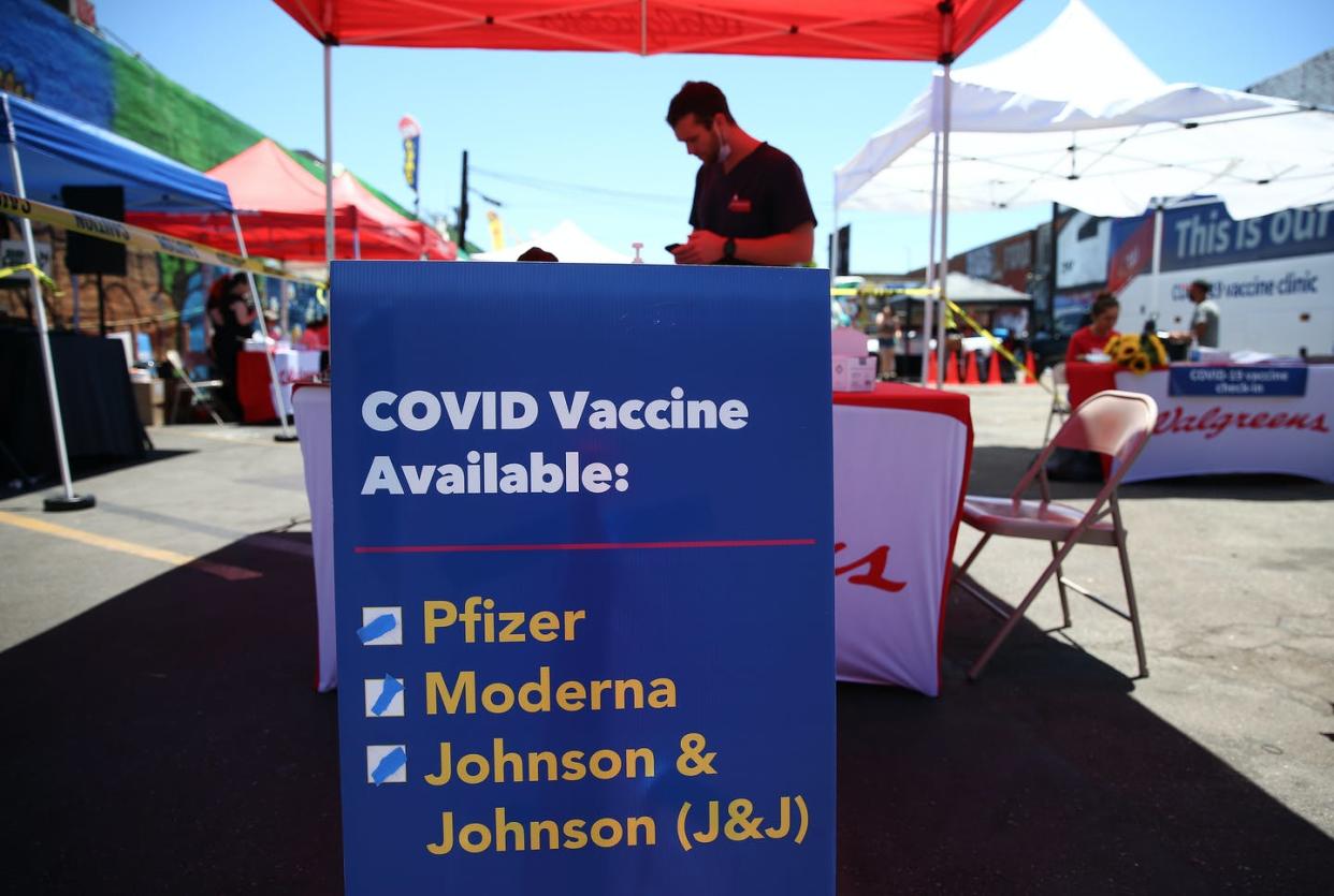 <span class="caption">With many vaccine-eligible people in the U.S. staying away, some vaccine sites have no lines. </span> <span class="attribution"><a class="link " href="https://www.gettyimages.com/detail/news-photo/sign-displays-the-types-of-covid-19-vaccination-doses-news-photo/1325495649?adppopup=true" rel="nofollow noopener" target="_blank" data-ylk="slk:Mario Tama/Getty Images;elm:context_link;itc:0;sec:content-canvas">Mario Tama/Getty Images</a></span>