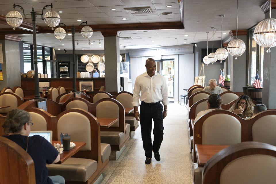 Eric Adams, the Democratic candidate for New York mayor, walks into a Brooklyn diner, Wednesday, Aug. 4, 2021, in New York. (AP Photo/Mark Lennihan)