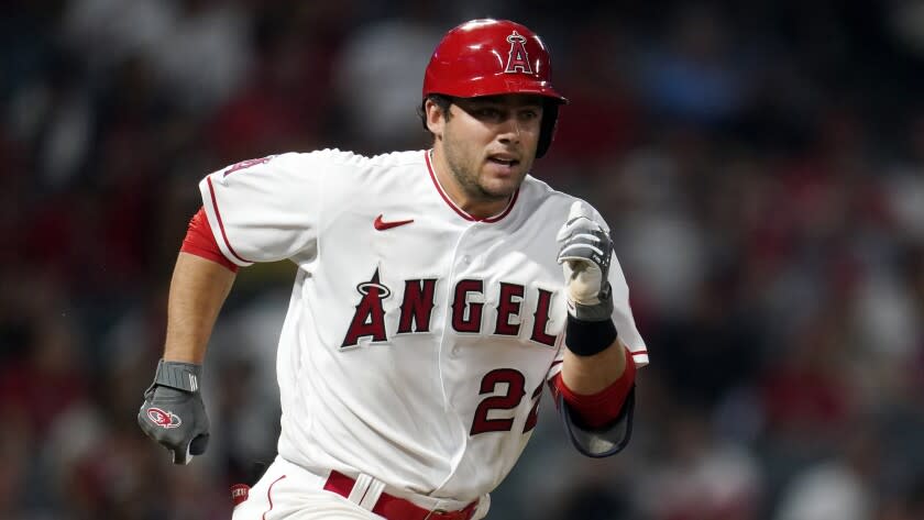 Los Angeles Angels' David Fletcher (22) runs to first base during a baseball game against the Houston Astros Friday, April 8, 2022, in Anaheim, Calif. (AP Photo/Marcio Jose Sanchez)