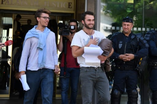 Swiss student Bastien Stauffer, 26, and Theo Buckmaster, a 23-year-old Swiss-Belgian, leave court in Gap in the French Alpes where they are on trial with an Italian student for helping migrants cross the border