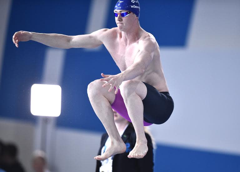 Scotland's Ross Murdoch prepares for the start of the Men's 100m Breaststroke semi-final at the Tollcross International Swimming Centre during the 2014 Commonwealth Games in Glasgow on July 25, 2014