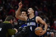 Orlando Magic's Jalen Suggs (4) celebrates after scoring the winning basket to defeat the Chicago Bulls in an NBA basketball game Friday, Nov. 18, 2022, in Chicago. (AP Photo/Paul Beaty)