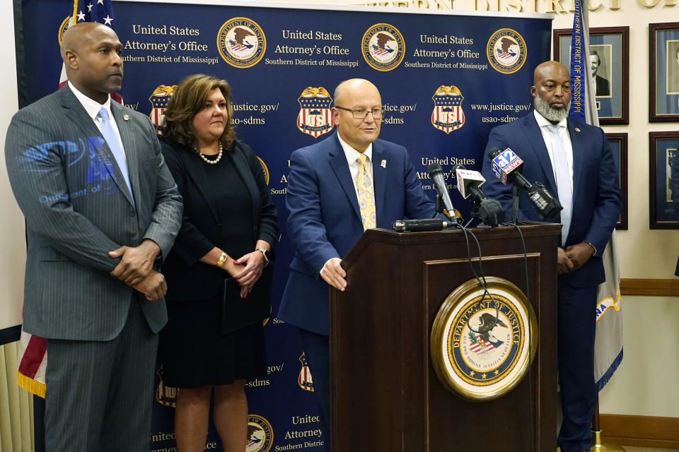 U.S. Attorney Darren J. LaMarca, center, speaks to reporters after six white former law enforcement officers in Mississippi pleaded guilty to federal civil rights offenses in federal court in Jackson, Miss., Thursday, Aug. 3, 2023. The six former officers who called themselves the “Goon Squad” pleaded guilty to a racist assault on two Black men in a home raid that ended with an officer shooting one man in the mouth. Joining LaMarca were Mississippi Bureau of Investigations Director Charles Haynes, left, Deputy Attorney General Mary Wall of the Mississippi Attorney General's Office, second from left, and Jermicha Fomby, Special Agent in Charge of the FBI Jackson Field Office. (AP Photo/Rogelio V. Solis)