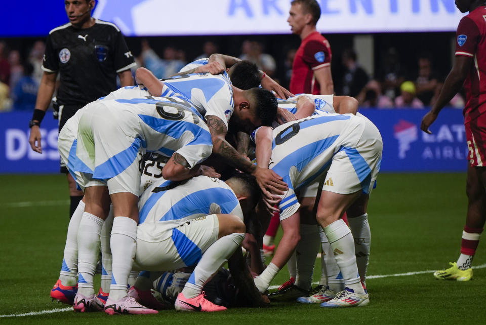 Argentina's players celebrate Julian Alvarez's opening goal against Canada during a Copa America Group A soccer match in Atlanta, Thursday, June 20, 2024. (AP Photo/Mike Stewart)
