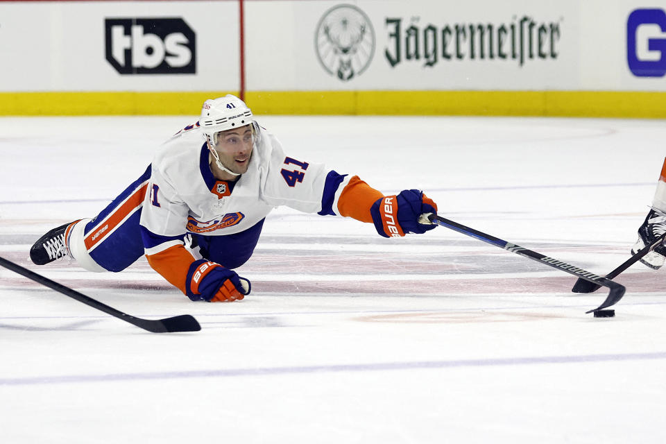 New York Islanders' Robert Bortuzzo (41) dives for the puck against the Carolina Hurricanes during the first period in Game 1 of an NHL hockey Stanley Cup first-round playoff series in Raleigh, N.C., Saturday, April 20, 2024. (AP Photo/Karl B DeBlaker)
