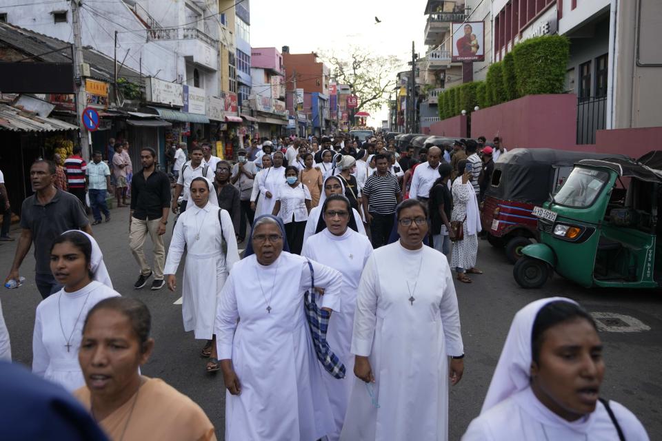 Sri Lankan Catholic nuns participate in a silent protest march to mark the fourth year commemoration of the 2019, Easter Sunday bomb attacks on Catholic Churches, in Colombo, Sri Lanka, Friday, April 21, 2023. Thousands of Sri Lankans held a protest in the capital on Friday, demanding justice for the victims of the 2019 Easter Sunday bomb attacks that killed nearly 270 people. (AP Photo/Eranga Jayawardena)