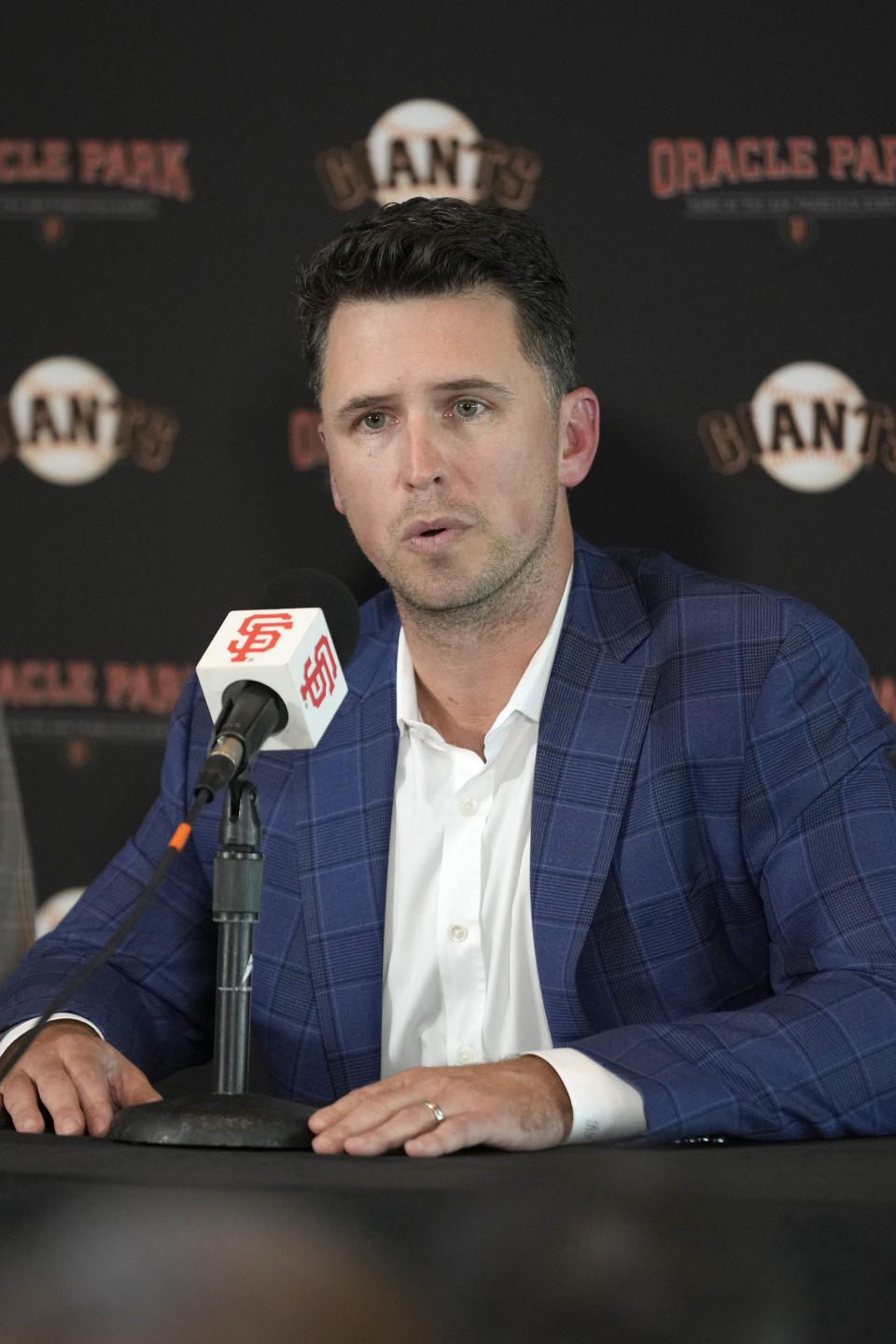 San Francisco Giants catcher Buster Posey talks during a news conference announcing his retirement from baseball, Thursday, Nov. 4, 2021, in San Francisco. (AP Photo/Tony Avelar)