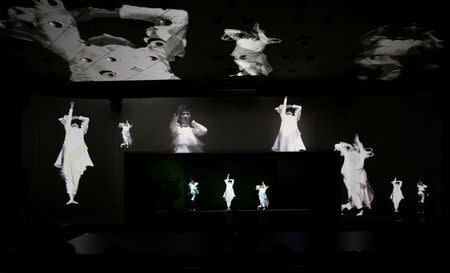 Japanese telecommunications company NTT's "Kirari! for Arena", which uses multiple cameras to track the movements of the player and images are transported to devices which show 3D hologram figures in real-time at a different location, shows dancers during the company's exhibition in Tokyo, Japan, February 22, 2018. REUTERS/Toru Hanai