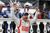 FILE - In this Aug. 3, 2014, file photo, Dale Earnhardt Jr. celebrates in Victory Lane after winning a NASCAR Sprint Cup Series auto race at Pocono Raceway in Long Pond, Pa. Longtime fan favorite Dale Earnhardt Jr. is expected to be the marquee name on NASCAR's 2021 Hall of Fame class, to be announced Tuesday, June 16, 2020. (AP Photo/Matt Slocum, File)