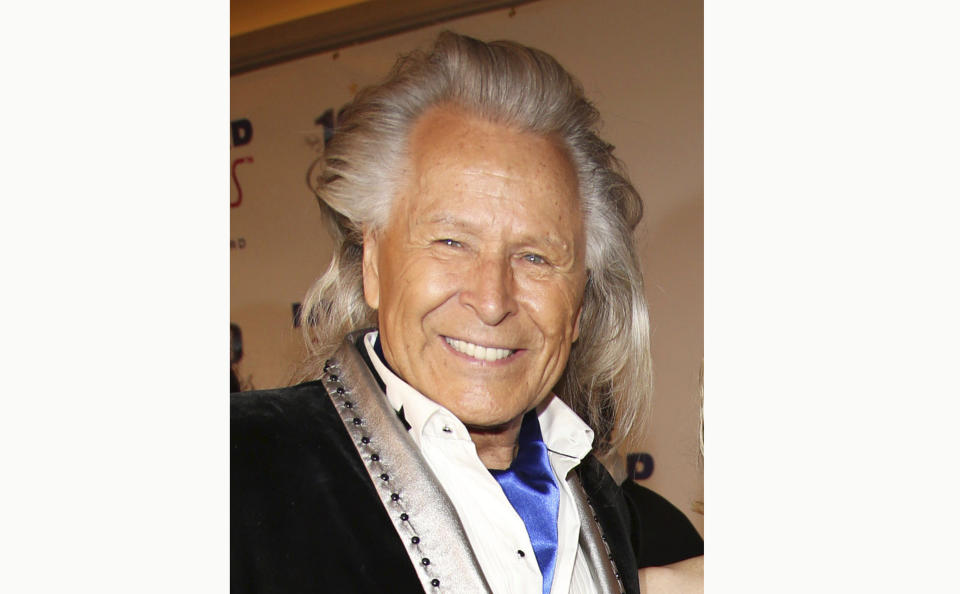 FILE - Peter Nygard attends the 24th Night of 100 Stars Oscars Viewing Gala on March 2, 2014, in Beverly Hills, Calif. Nygard faces criminal charges in New York after his Canadian arrest on charges alleging that he dangled opportunities in fashion and modeling to lure dozens of women and girls to have sex with himself and others. The 79-year-old Nygard awaited an appearance in a Winnipeg courtroom after his Monday, Dec. 14, 2020, arrest in Winnipeg, Manitoba, Canada by Canadian authorities at the request of the United States. (Photo by Annie I. Bang /Invision/AP, File)