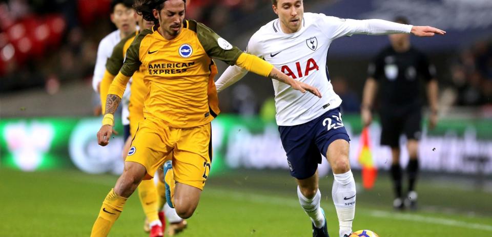 Tottenham scored a goal in each half as they beat Brighton 2-0 at Wembley Stadium.