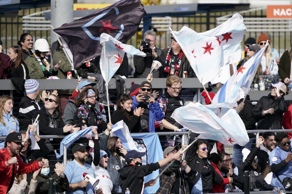 Supporters cheer after Chicago Red Stars forward Rachel Hill scores a goal during the first half of the NWSL Championship soccer match against the Washington Spirit, Saturday, Nov. 20, 2021, in Louisville, Kentucky. (AP Photo/Jeff Dean)