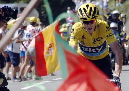 Team Sky rider Chris Froome of Britain, race leader's yellow jersey, climbs on his way to win the 167-km (103.7 miles) 10th stage of the 102nd Tour de France cycling race from Tarbes to La Pierre-Saint -Martin, France, July 14, 2015. REUTERS/Eric Gaillard