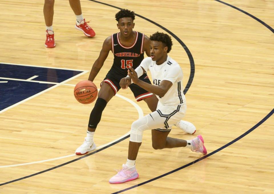 Bronny James #0 of Sierra Canyon Trailblazers passes the ball as he’s defended by Hercy Miller #15 of Minnehaha Academy Red Hawks in the first half of the game at Target Center on January 04, 2020 in Minneapolis, Minnesota. (Photo by Stephen Maturen/Getty Images)