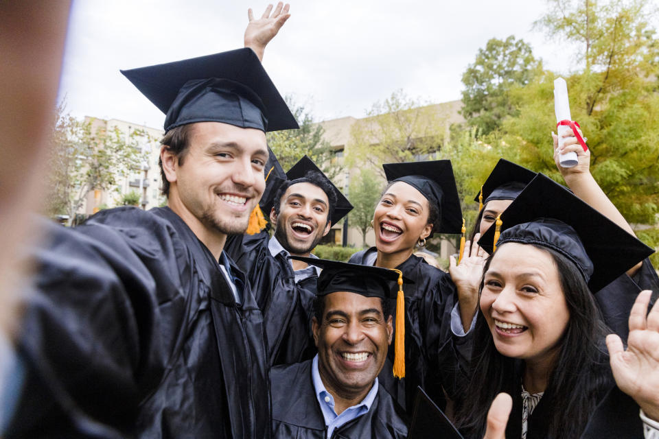 students taking a graduation selfie