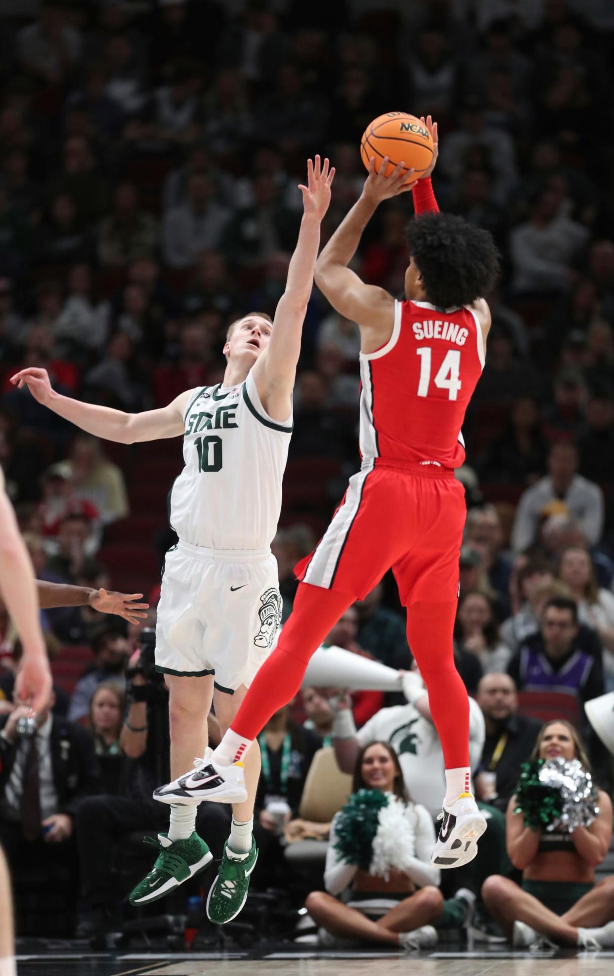 Michigan State Spartans forward Joey Hauser defends Ohio State Buckeyes forward Justice Sueing during the first half of the Big Ten tournament quarterfinals in Chicago, Friday, March 10, 2023.