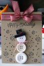 <p>Send a taste of home with this cute card, complete with a snowman made of buttons. You can even switch it up and use buttons to make ornaments or a Christmas wreath. </p><p><a href="http://deedeecampbell.blogspot.com/2012/12/3-button-snowman-card-and-christmas.html" rel="nofollow noopener" target="_blank" data-ylk="slk:See more at Scrappin' with DeeDee »;elm:context_link;itc:0;sec:content-canvas" class="link "><em>See more at Scrappin' with DeeDee »</em></a><br></p>