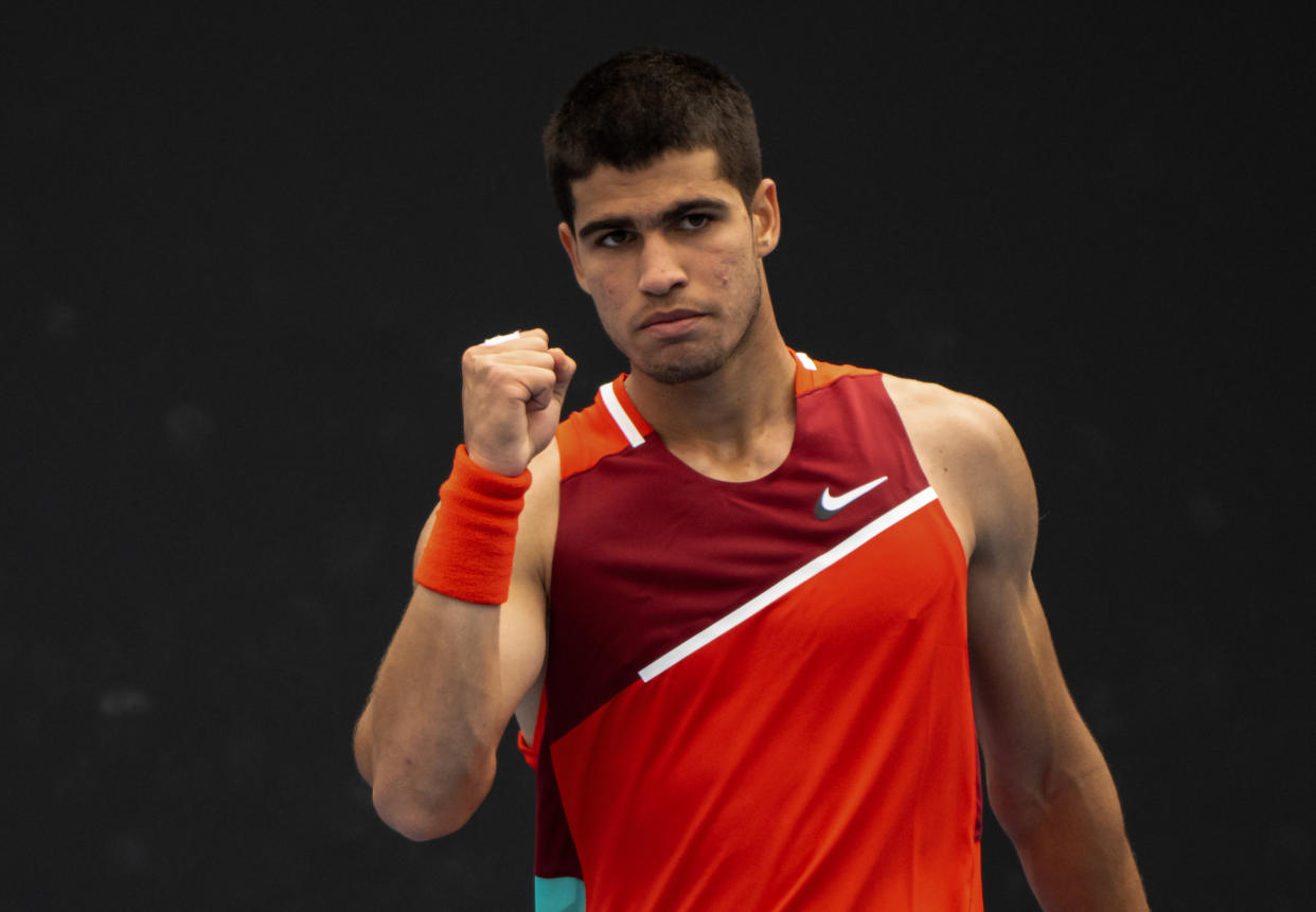 MELBOURNE, AUSTRALIA - JANUARY 17: Carlos Alcaraz of Spain celebrates during against Alejandro Tabilo of Chile in the first round of the men's singles during day one of the 2022 Australian Open at Melbourne Park on January 17, 2022 in Melbourne, Australia. (Photo by TPN/Getty Images)