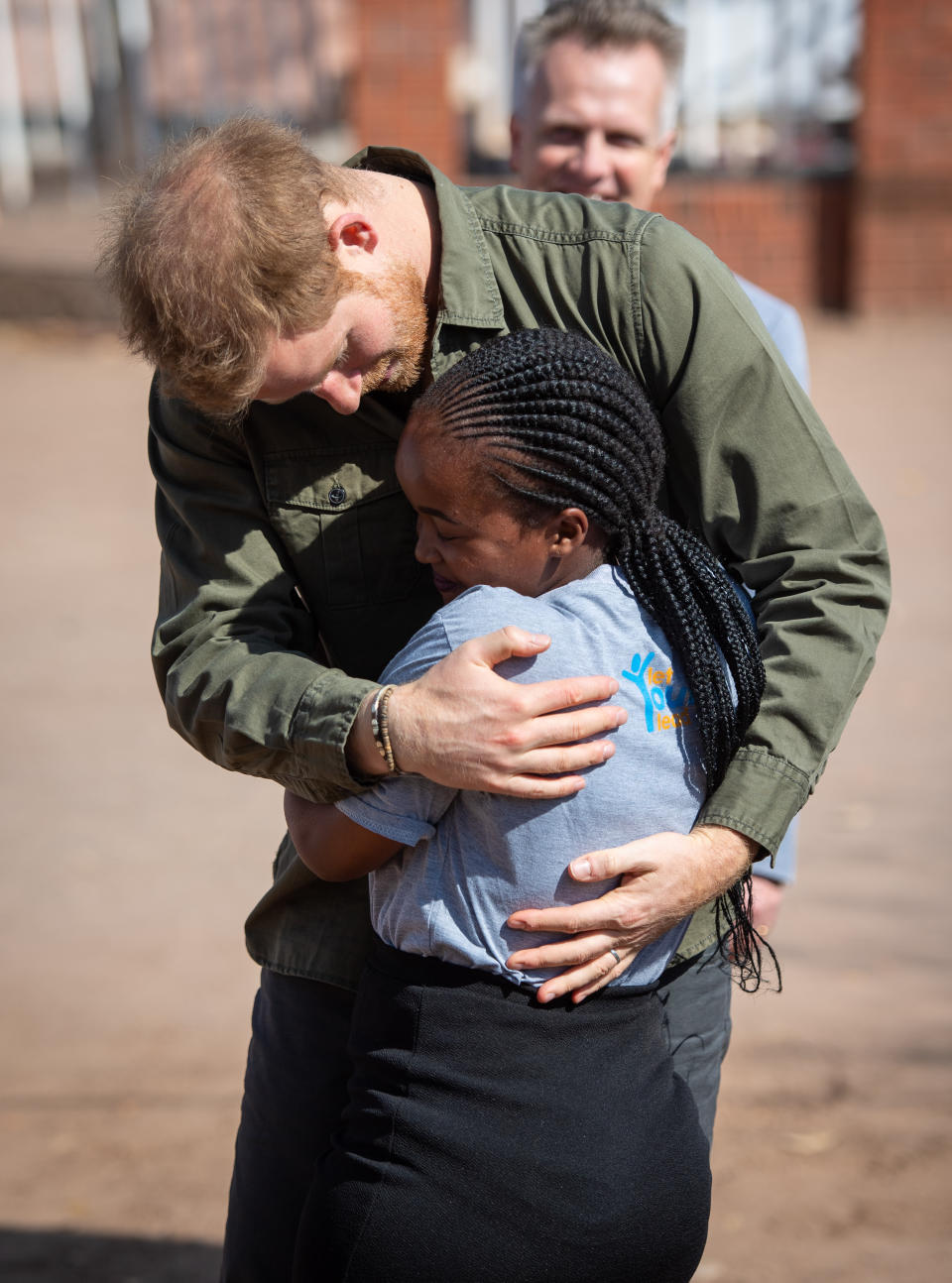 The Duke of Sussex is greeted by Tlotlo Moilwa during a visit to the Kasane Health Post, run by the Sentebale charity, in Kasane, Botswana.