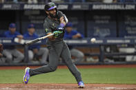 Tampa Bay Rays' Amed Rosario connects for an RBI single off New York Mets relief pitcher Jorge Lopez during the sixth inning of a baseball game Friday, May 3, 2024, in St. Petersburg, Fla. (AP Photo/Chris O'Meara)